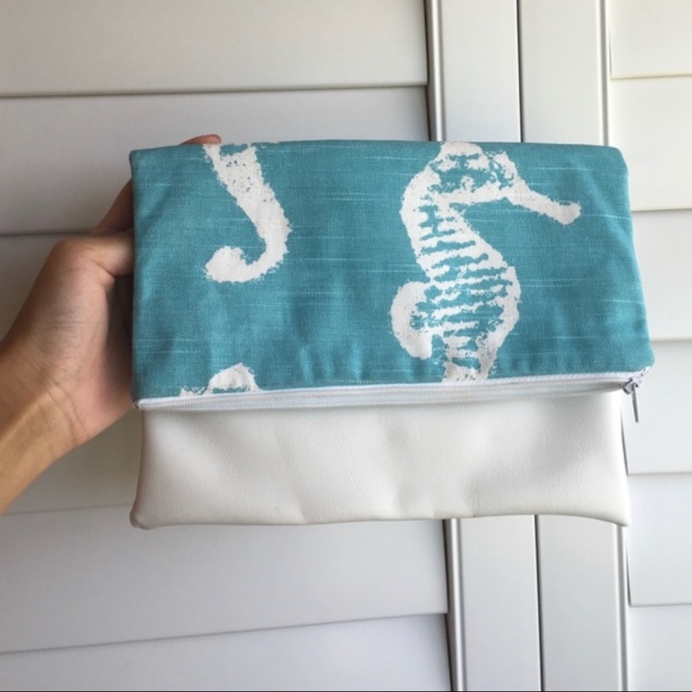 3/$30. Local Hawaiian seashell and leather clutch